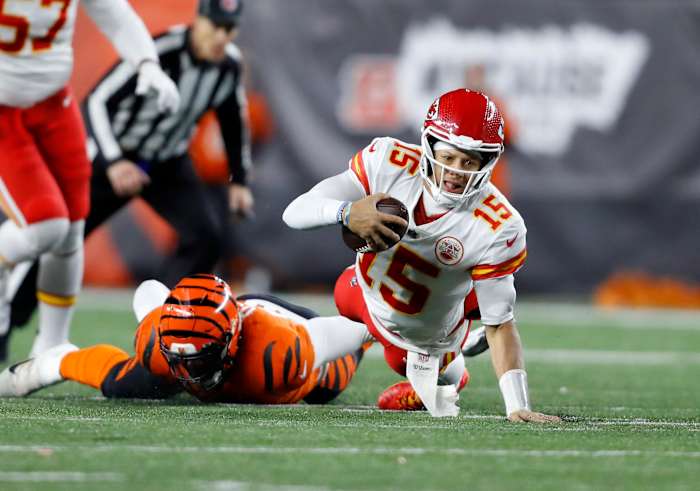Dec 4, 2022; Cincinnati, Ohio, USA; Kansas City Chiefs quarterback Patrick Mahomes (15) is sacked by Cincinnati Bengals defensive end Joseph Ossai (58)during the fourth quarter at Paycor Stadium. Mandatory Credit: Joseph Maiorana-USA TODAY Sports